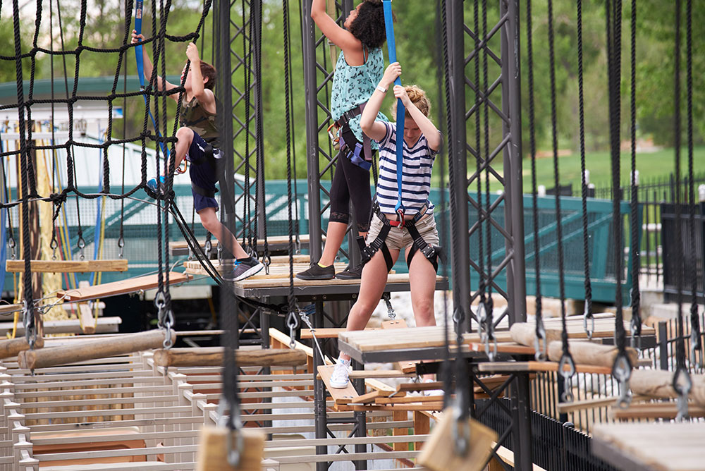 three kids on rope course