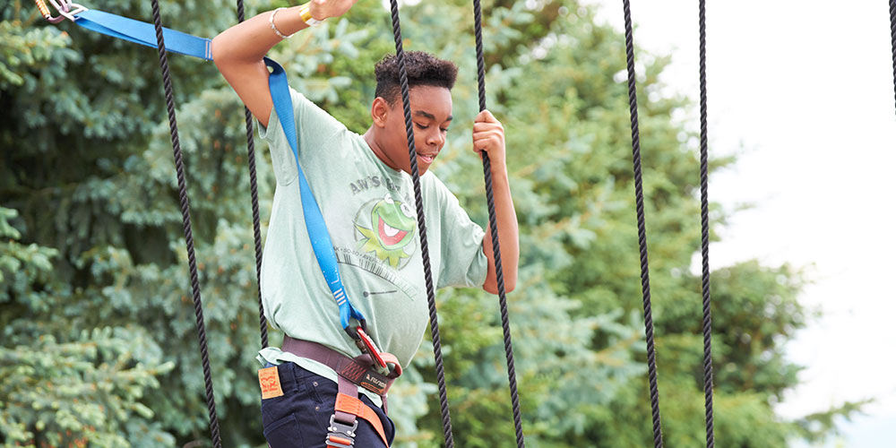 boy on ropes course