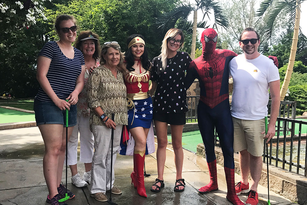 group of 7 people including spiderman and wonder woman